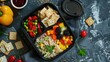 Healthy lunch box with rice, vegetables and crackers on dark background