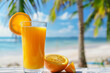 Fresh orange juice on the background of the sea beach.