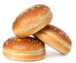 Three sesame seed burger buns stacked on a white background