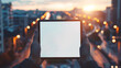 Free copy space blank screen display tablet in the hands on the blurred sunset cityscape background. Mockup for text, images.