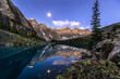 Alpine lake in mountains at early morning.  Moraine Lake in Banff National Park, Canadian Rockies, Alberta, Canada.