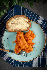 Canvas Print - Fish in Greek kind with vegetables and tomato sauce.