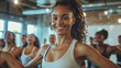 © P - Enthusiastic individuals join a dance fitness class, moving to the rhythm of upbeat music and dynamic choreography, experiencing the joy and exhilaration of movement and activity.