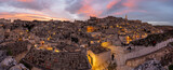 Fototapeta Londyn - Panorama of the historic old town of Matera in southern Italy after sunset