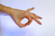 caucasian hand doing communication gesture , circle sign