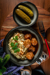 Wall Mural - Meatballs pork and mashed potatoein paprika gravy served with groats bulgur.