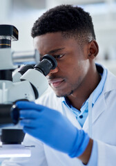 Poster - African man, scientist and microscope in lab with analysis for test sample, experiment or dna pattern. Person, gloves and ppe for medical research at pharma company with thinking, gear and innovation