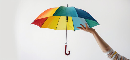 Aufkleber - Person holding a multicolored umbrella, suitable for various concepts and designs