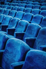 Poster - A row of blue seats in a theater. Ideal for advertising events or venues