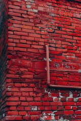Poster - A red brick building with a fire hydrant in front of it. Suitable for urban and architecture concepts