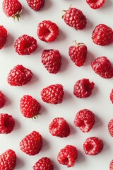 Poster - Ripe raspberries arranged on a clean white surface, perfect for food and health concepts