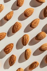 Poster - Fresh almonds on a clean white background, perfect for food and nutrition concepts