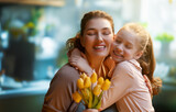 Fototapeta  - daughter and mom with flowers