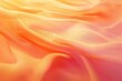 Abstract background with blurred, gentle waves of orange and pink silk fabric