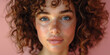 A bright portrait of a calm and natural young woman with freckles and attractive features.