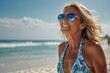 Middle aged beautiful girl smiling in swimsuit sunglasses on the beach. Concept, vacation, template, copy space, banner,