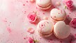 Heart-shaped macaroons with rose flower on a pink pastel background