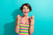 © deagreez - Portrait of excited overjoyed lady celebrating big great win raise fists screaming yes yeah isolated teal color background