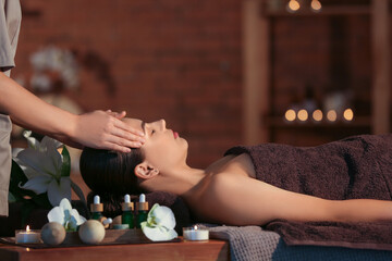 Sticker - Young woman getting massage in dark spa salon, closeup