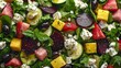   A salad with beets, cucumbers, feta cheese, and spinach leaves