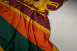 waving national flag of sri lanka on a gray background.