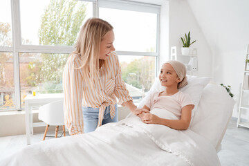 Canvas Print - Little Asian girl after chemotherapy with her mother lying in clinic