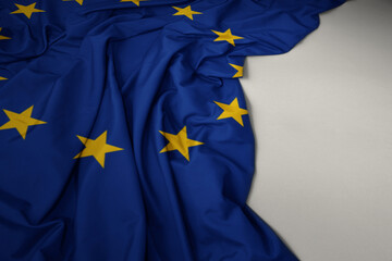 Wall Mural - waving national flag of european union on a gray background.