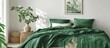 Green blanket is spread on the bed in a stylish bedroom setting, along with a poster displayed on the white wall and a plant placed on the table.