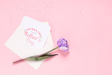 Wall Mural - Greeting card with text HAPPY MOTHER'S DAY and beautiful lilac tulip on pink background