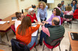© ADDICTIVE STOCK - Senior adults engaging in group discussion at a class