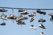 Shoes hanging on electric wires on the street