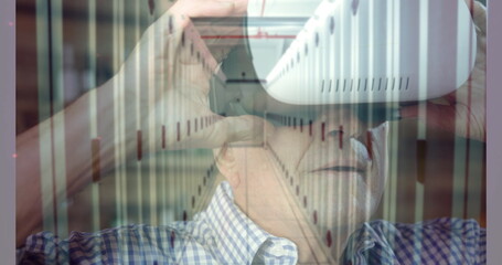 Poster - Caucasian senior male with glasses looking at computer screen