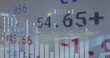 Financial graphs and numbers overlay on blurry cityscape background