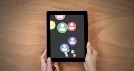 Poster - Hands clutch tablet showing vibrant social media icons