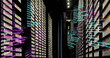 Rows of server racks with colorful lights are displaying data