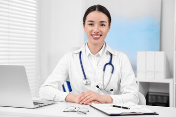 Sticker - Medical consultant with stethoscope at table in clinic