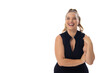 Caucasian young female plus size model laughing on white background, wearing black dress, copy space