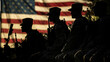 silhouette of united states soldiers with their flag behind