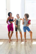 © Wavebreak Media - Three diverse women are laughing together in a bright yoga studio, copy space