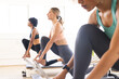 © Wavebreak Media - Three diverse women are exercising on pilates machines in a studio
