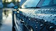 Shimmering droplets of pure water glisten on the sleek surface of a freshly washed car