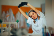 Scientist Stretching Arms in a Laboratory Working on a Project. Researcher enjoying her work taking a break in the lab
