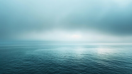 Wall Mural - Peaceful ocean expanse under overcast skies in soothing shades