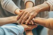 © Dusit - A group of people are holding hands in a circle.