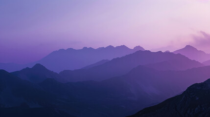 Wall Mural - Serene mountain silhouettes cast in soothing purple hues of dusk