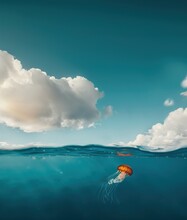 AI Generated Image, Half Underwater Shot, Tropical Ocean, Blue Sky And Clear Water With An Orange Tiny Jellyfish