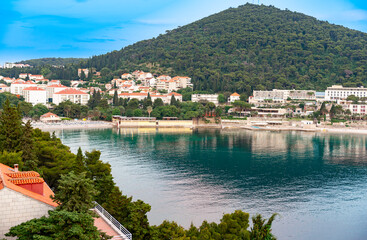 Canvas Print - Wooded hill behind Lapad beach holiday destination Croatia