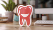 Happy tooth character sticker with white border on a wooden desk. Dental care concept with copy space. Design for health education materials, poster, banner