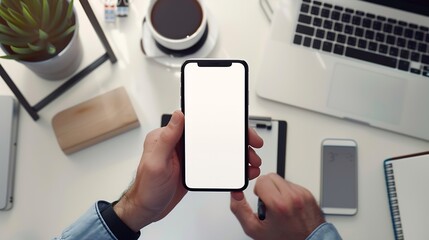 Wall Mural - Man using mobile phone at office white desk table with desktop computer office supplies and coffee mug Top view workspace and blank screen smartphone : Generative AI