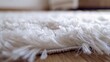 Closeup detail of white shaggy carpet on brown wooden floor Hairy carpet detail : Generative AI